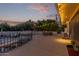 Outdoor patio area with firepit and string lights at 7760 E Carefree Dr, Carefree, AZ 85377