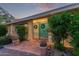 Evening view of the home's exterior and landscaping at 7760 E Carefree Dr, Carefree, AZ 85377