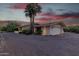 Single-story home with a white brick facade and a two-car garage at 7760 E Carefree Dr, Carefree, AZ 85377
