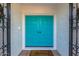 Front exterior view with teal doors and landscaping at 7760 E Carefree Dr, Carefree, AZ 85377
