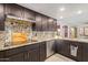 Modern kitchen with granite countertops and dark cabinetry at 7760 E Carefree Dr, Carefree, AZ 85377