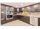 Modern kitchen with granite countertops and stainless steel appliances at 7760 E Carefree Dr, Carefree, AZ 85377
