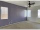 Bright bedroom featuring neutral walls, plush carpeting, and natural light at 8014 E Plata Ave, Mesa, AZ 85212