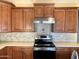 Detailed kitchen cabinets with stainless steel appliances and quartz countertops at 8014 E Plata Ave, Mesa, AZ 85212