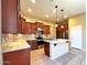 Modern kitchen with stainless steel appliances and stone countertops at 8014 E Plata Ave, Mesa, AZ 85212