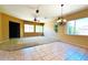 Open living space with carpet and tile flooring, lots of natural light, and stylish ceiling fans at 8014 E Plata Ave, Mesa, AZ 85212