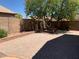 Brick paved patio with a built in planter and a tree at 8014 E Plata Ave, Mesa, AZ 85212
