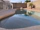 Inviting kidney-shaped pool with a pebble finish and a large backyard at 8014 E Plata Ave, Mesa, AZ 85212
