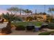 Landscaped backyard with putting green and seating area at 8040 E Laurel St, Mesa, AZ 85207