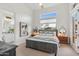 Serene bedroom with king bed and private bathroom access at 8040 E Laurel St, Mesa, AZ 85207