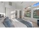 Spacious bedroom with king-size bed and access to a private patio at 8040 E Laurel St, Mesa, AZ 85207