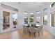 Bright dining room with round table and seating for six at 8040 E Laurel St, Mesa, AZ 85207