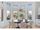 Casual dining area with large windows and pool view at 8040 E Laurel St, Mesa, AZ 85207