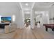 Bright entryway with hardwood floors, views to backyard and pool, and a pool table at 8040 E Laurel St, Mesa, AZ 85207