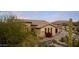 Single story home with arched entryway and desert landscaping at 8040 E Laurel St, Mesa, AZ 85207