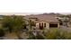 Single story home with arched entry and desert landscaping at 8040 E Laurel St, Mesa, AZ 85207