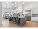 Modern kitchen with large island, stainless steel appliances, and white cabinetry at 8040 E Laurel St, Mesa, AZ 85207