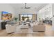 Open living area with large sectional sofa,sliding glass doors, and modern decor at 8040 E Laurel St, Mesa, AZ 85207