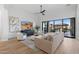 Bright living room with large windows, stylish seating, and a modern aesthetic at 8040 E Laurel St, Mesa, AZ 85207