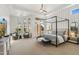 Spacious main bedroom with canopy bed and sitting area at 8040 E Laurel St, Mesa, AZ 85207