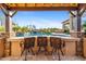 Relaxing pool area with barstools and a view of the pool and waterfall feature at 8040 E Laurel St, Mesa, AZ 85207