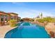 Large turquoise pool with a spa and outdoor seating at 8040 E Laurel St, Mesa, AZ 85207