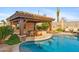 Inviting pool area with swim-up bar and outdoor kitchen at 8040 E Laurel St, Mesa, AZ 85207