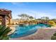 Relaxing pool and spa with waterfall feature and stone accents at 8040 E Laurel St, Mesa, AZ 85207
