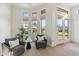 Relaxing sitting area with comfy chairs and backyard access at 8040 E Laurel St, Mesa, AZ 85207