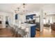 Stylish kitchen with white quartz island, blue cabinets, and stainless steel appliances at 8638 E Whitton Ave, Scottsdale, AZ 85251