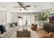 Living room boasts wood floors, large windows, and a neutral color scheme at 8638 E Whitton Ave, Scottsdale, AZ 85251