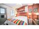 Cozy bedroom with a double bed and built-in shelving at 880 Motherlode Dr # 1099, Apache Junction, AZ 85119