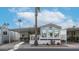 Mobile home with covered carport and desert landscaping at 880 Motherlode Dr # 1099, Apache Junction, AZ 85119