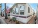 Mobile home with covered carport and desert landscaping at 880 Motherlode Dr # 1099, Apache Junction, AZ 85119