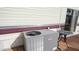 Exterior view of home with AC unit and small table at 880 Motherlode Dr # 1099, Apache Junction, AZ 85119
