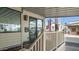 Inviting exterior with a covered porch and American flag at 880 Motherlode Dr # 1099, Apache Junction, AZ 85119