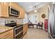 Kitchen features stainless steel appliances and a breakfast nook at 8864 E Sunnyside Dr, Scottsdale, AZ 85260