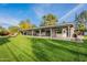 Expansive grassy backyard with covered patio at 9254 N 82Nd St, Scottsdale, AZ 85258