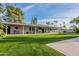 Large backyard with covered patio and lush lawn at 9254 N 82Nd St, Scottsdale, AZ 85258