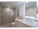 Modern bathroom with a frameless shower, marble vanity, and LED mirror at 9254 N 82Nd St, Scottsdale, AZ 85258