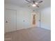 Bright bedroom with double door closet and neutral carpeting at 9254 N 82Nd St, Scottsdale, AZ 85258