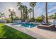 Inviting backyard oasis with a sparkling pool and comfortable lounge chairs at 9254 N 82Nd St, Scottsdale, AZ 85258
