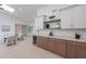 Stylish wet bar with wine cooler, quartz countertops, and wooden cabinetry at 9254 N 82Nd St, Scottsdale, AZ 85258