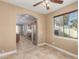 This dining area features tile flooring and lots of natural light coming from the large window at 10826 W Woodland Ave, Avondale, AZ 85323