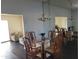 Dining area with glass table and chandelier near living room at 11133 W Granada Dr, Sun City, AZ 85373