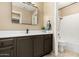 This bathroom features a long vanity, ample storage, and a shower-tub combo with white tile at 11260 N 92Nd St # 1102, Scottsdale, AZ 85260