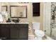 This bathroom features a dark vanity, vessel sink, granite counters, and a stone-tiled shower at 11260 N 92Nd St # 1102, Scottsdale, AZ 85260