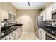Modern kitchen with stainless steel appliances and granite countertops at 11260 N 92Nd St # 1102, Scottsdale, AZ 85260