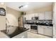Modern kitchen with stainless steel appliances and granite countertops at 11260 N 92Nd St # 1102, Scottsdale, AZ 85260