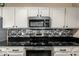 Modern kitchen features stainless steel appliances and granite countertops at 11260 N 92Nd St # 1102, Scottsdale, AZ 85260